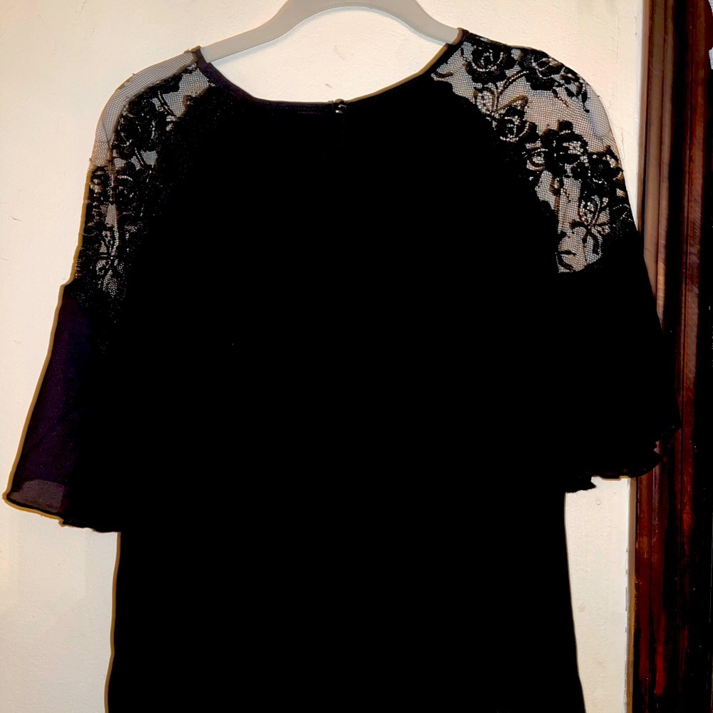 Lace shoulder top black new without tags medium runs small. Ruffle 3/4 sleeve